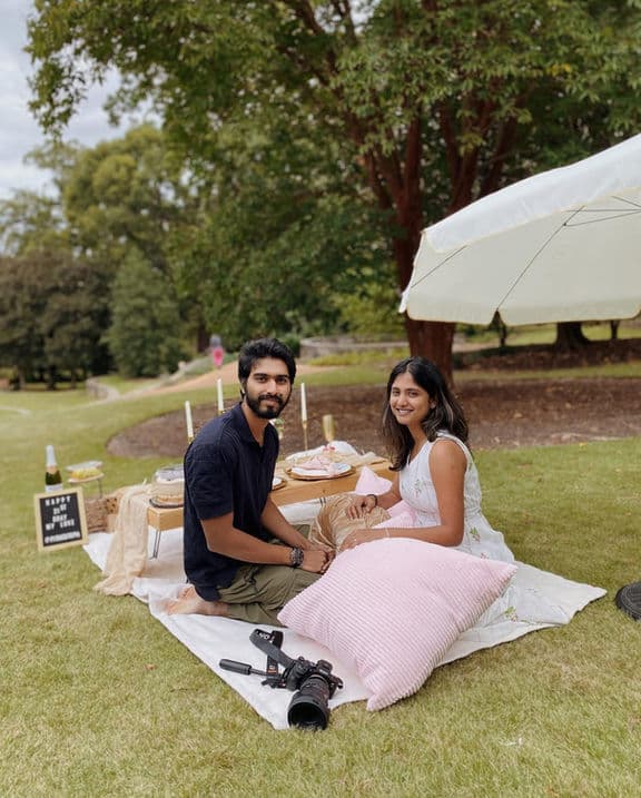 Luxury villa-style picnic setup with fuchsia accents and neon lights